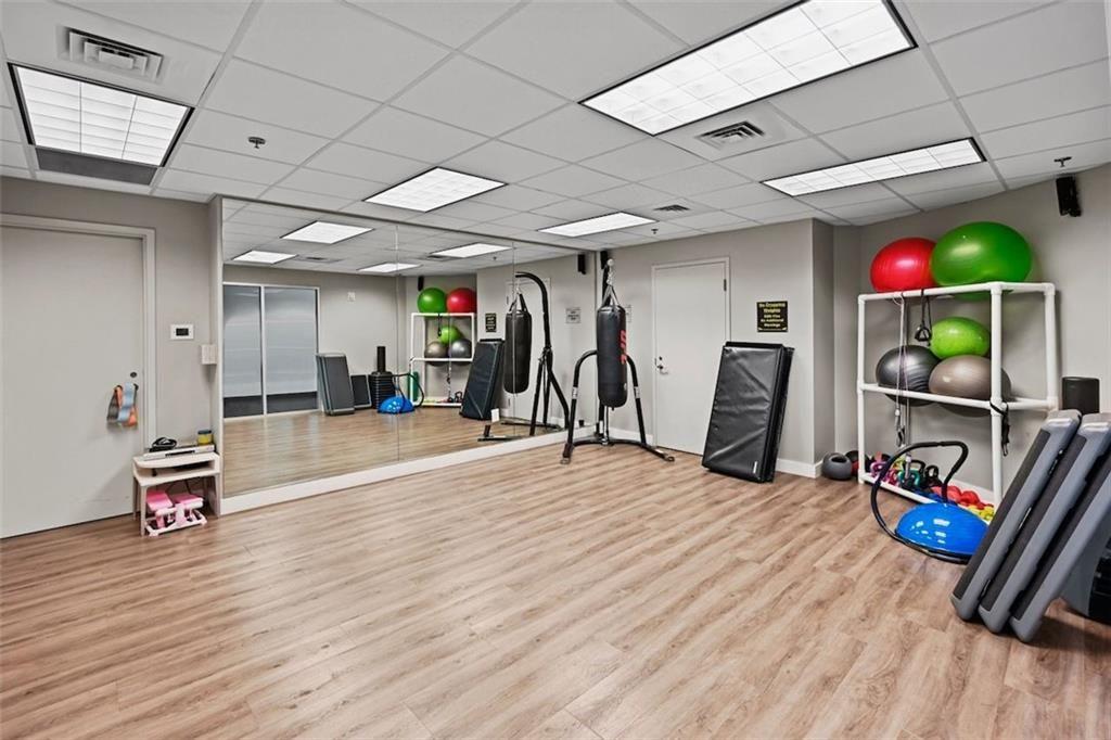 250 Pharr Road Northeast, Unit 602 Atlanta, GA 30305 - Photo 25 of 38 a view of a room with gym equipment