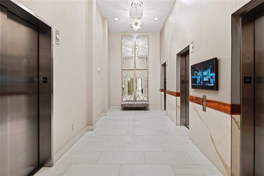 250 Pharr Road Northeast, Unit 602 Atlanta, GA 30305 - Photo 5 of 38 a view of a hallway with a living room