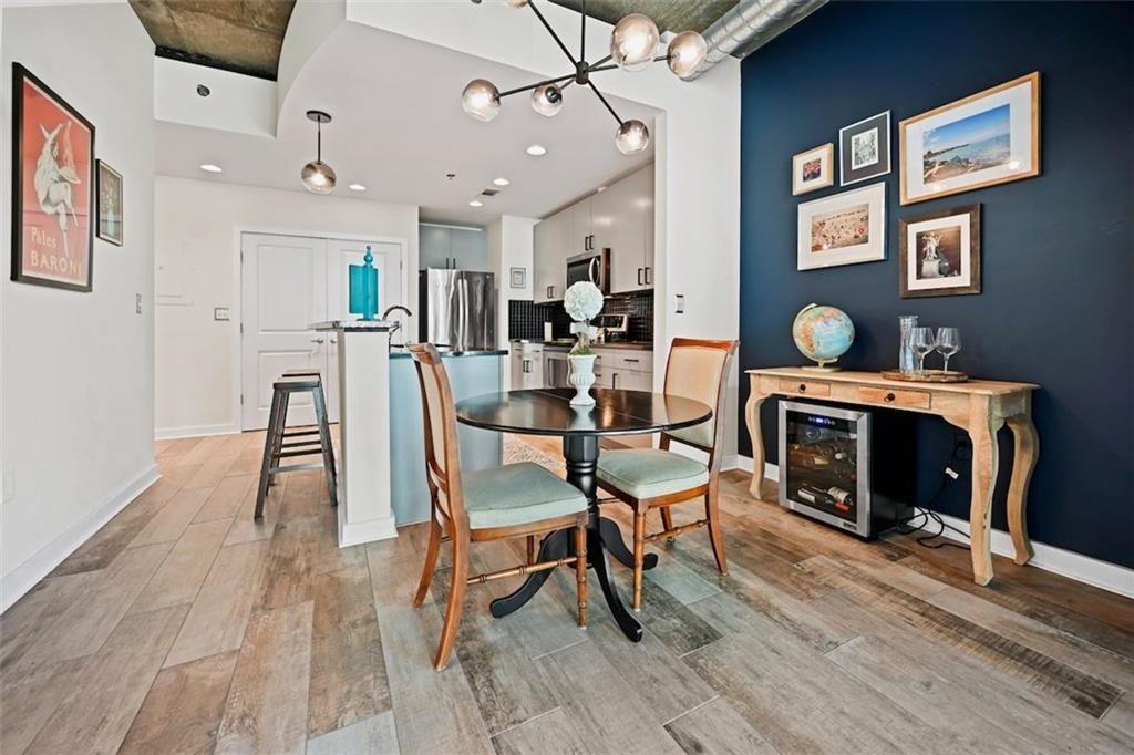 250 Pharr Road Northeast, Unit 602 Atlanta, GA 30305 - Photo 8 of 38 a dining room with furniture and fireplace