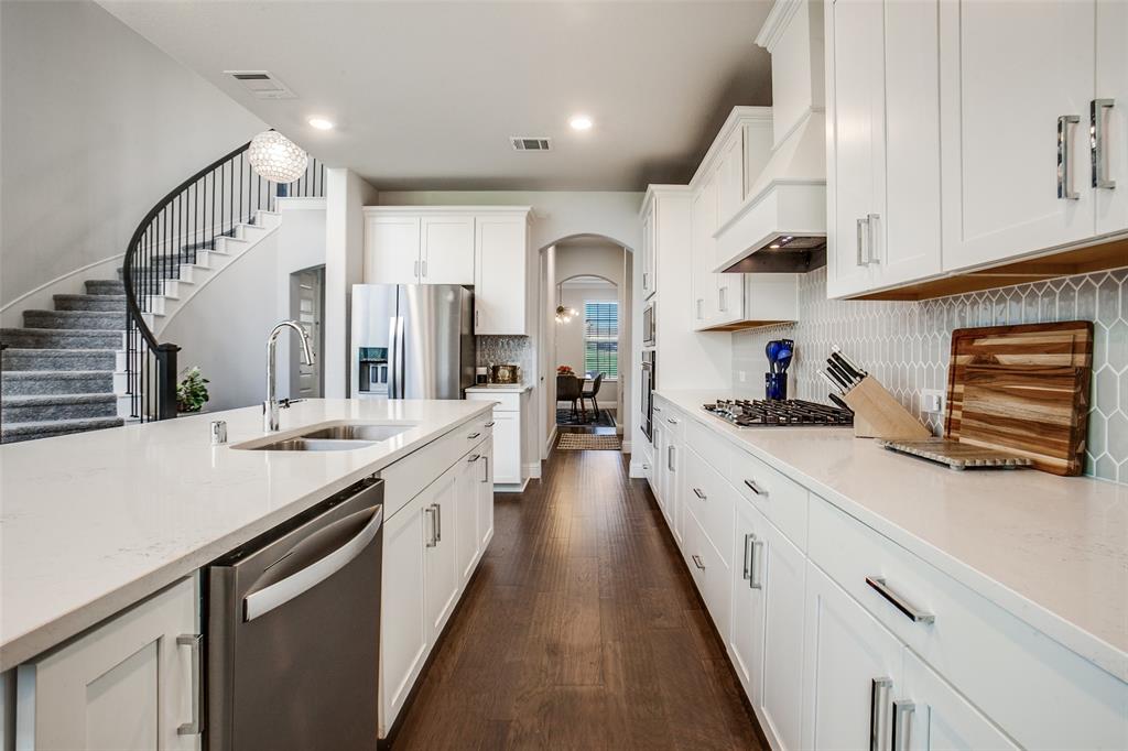 311 Suncrest Way Sunnyvale, TX 75182 - Photo 16 of 40 a large kitchen with stainless steel appliances lots of counter space and a sink