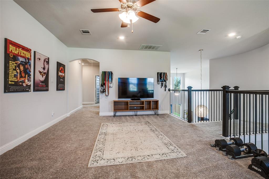 311 Suncrest Way Sunnyvale, TX 75182 - Photo 23 of 40 a living room with furniture and a flat screen tv