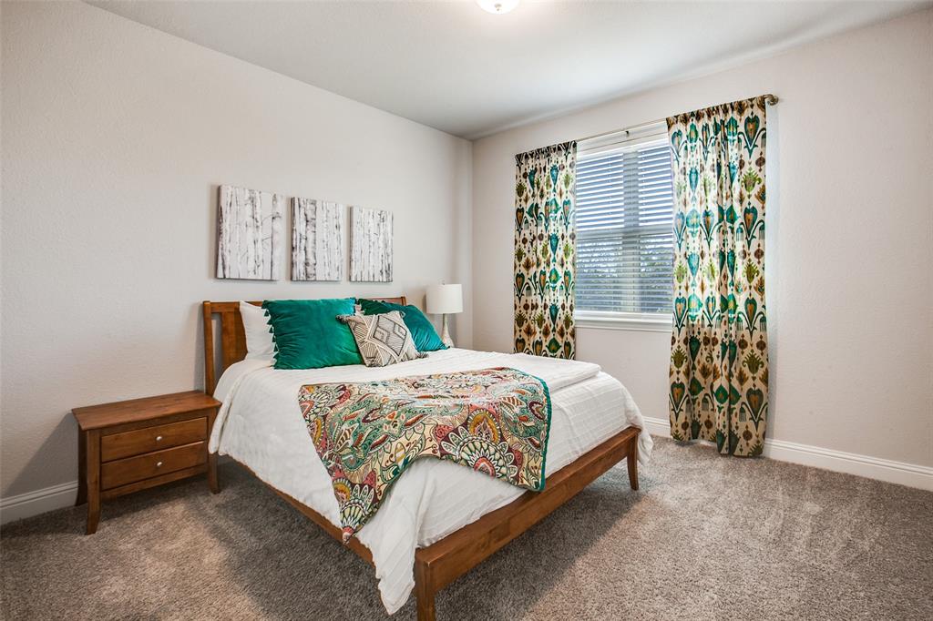 311 Suncrest Way Sunnyvale, TX 75182 - Photo 28 of 40 a bedroom with a bed and a window