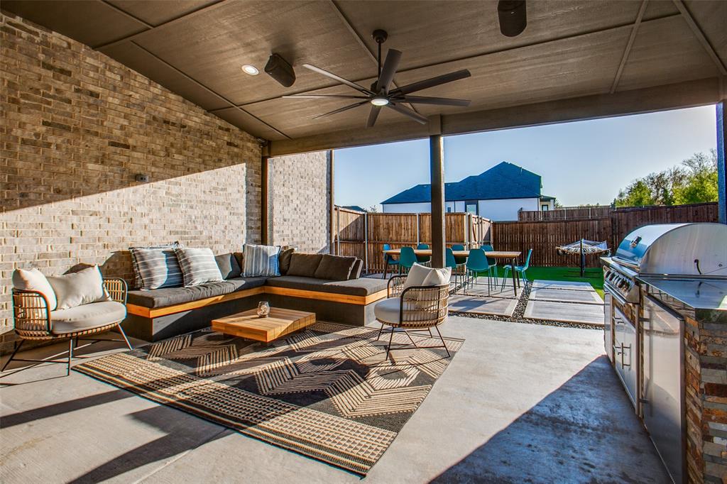 311 Suncrest Way Sunnyvale, TX 75182 - Photo 32 of 40 an outdoor sitting area with furniture and umbrella
