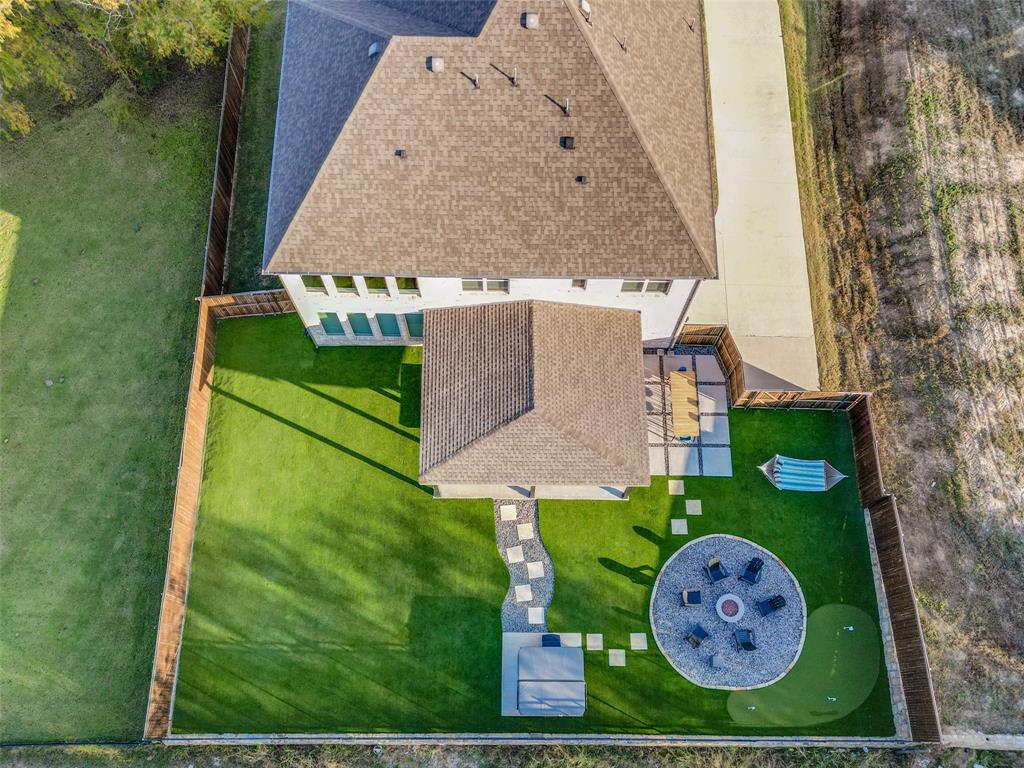 311 Suncrest Way Sunnyvale, TX 75182 - Photo 36 of 40 an aerial view of a house with garden space sitting space and swimming pool