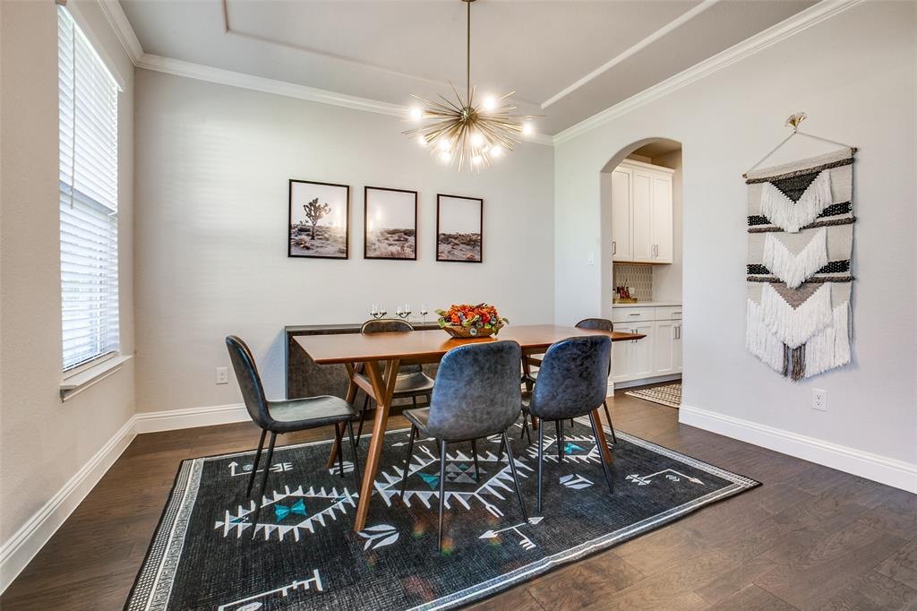 311 Suncrest Way Sunnyvale, TX 75182 - Photo 5 of 40 a view of a dining room with furniture and wooden floor