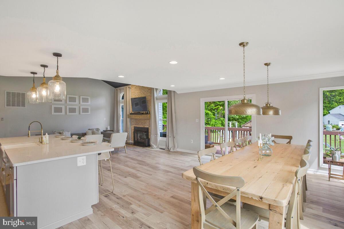 175-m F M F Bowen Road Huntingtown, MD 20639 - Photo 17 of 47 a large kitchen with a table and chairs
