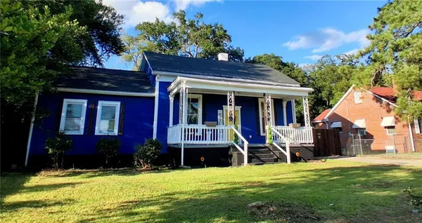 a view of house with yard and entertaining space