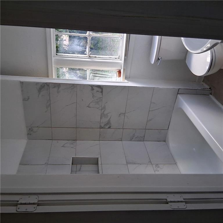 3435 Hillcrest Road Macon, GA 31204 - Photo 5 of 12 a bathroom with a sink and a mirror