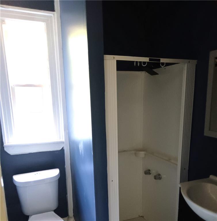 3435 Hillcrest Road Macon, GA 31204 - Photo 8 of 12 a bathroom with a toilet and a window