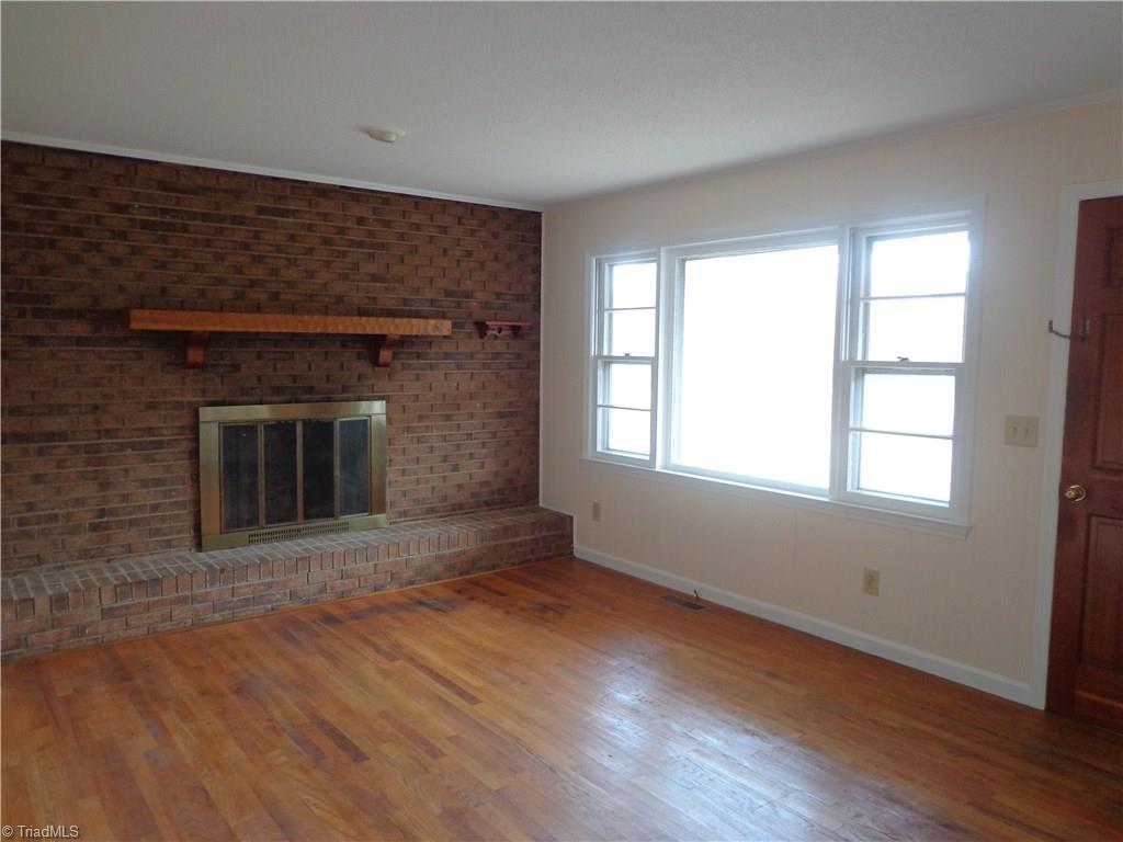 Living Room Has HDWD floors, FP and Updated Paint