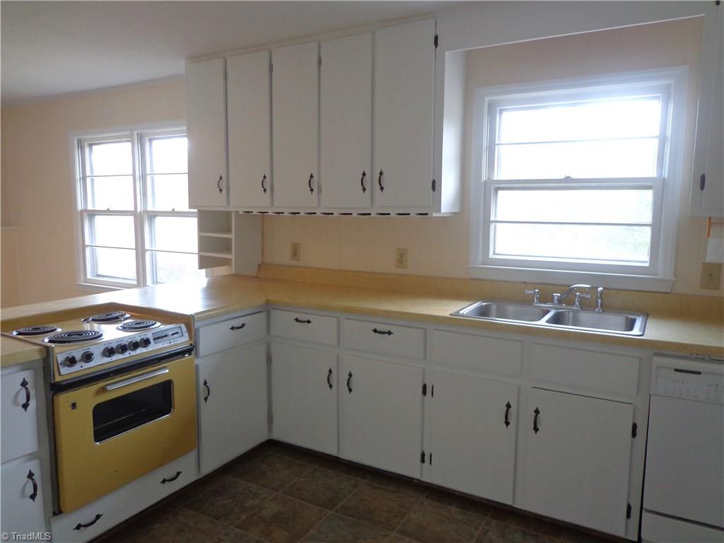 Spacious Kitchen has updated paint & flooring