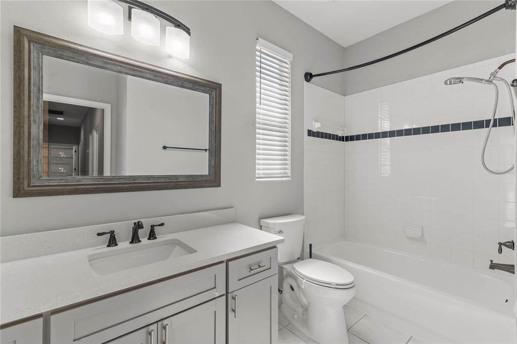 121 Figtree Run Longwood, FL 32750 - Photo 13 of 33 a bathroom with a sink a toilet and shower
