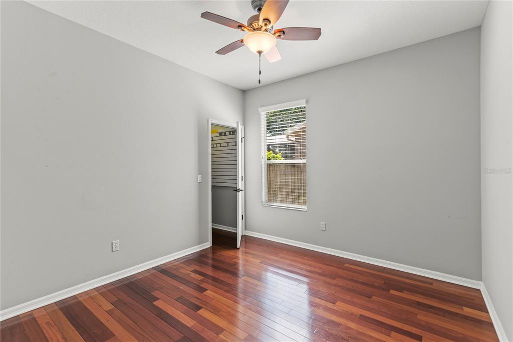 121 Figtree Run Longwood, FL 32750 - Photo 14 of 33 wooden floor in an empty room with a window