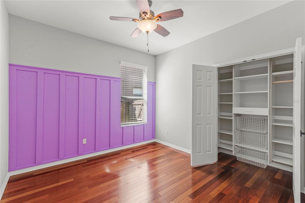121 Figtree Run Longwood, FL 32750 - Photo 15 of 33 a view of an empty room with a window and wooden floor