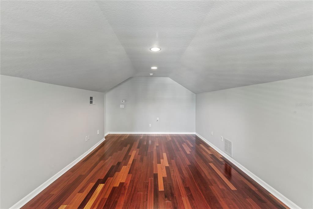 121 Figtree Run Longwood, FL 32750 - Photo 19 of 33 a view of empty room with wooden floor