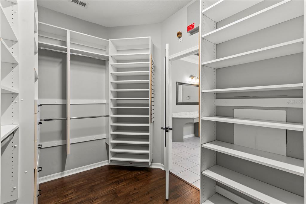 121 Figtree Run Longwood, FL 32750 - Photo 25 of 33 a view of walk in closet with empty racks