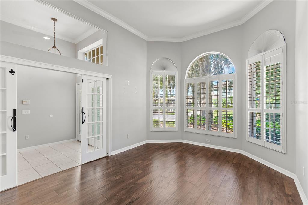 121 Figtree Run Longwood, FL 32750 - Photo 26 of 33 a view of empty room with wooden floor and fan