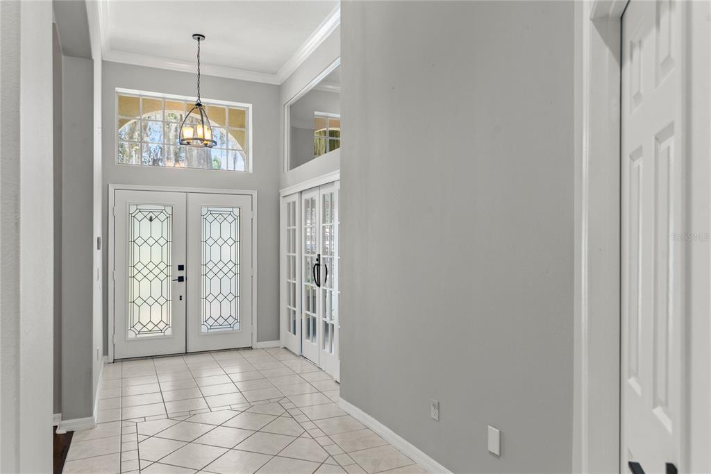 121 Figtree Run Longwood, FL 32750 - Photo 4 of 33 a view of an entryway with wooden floor