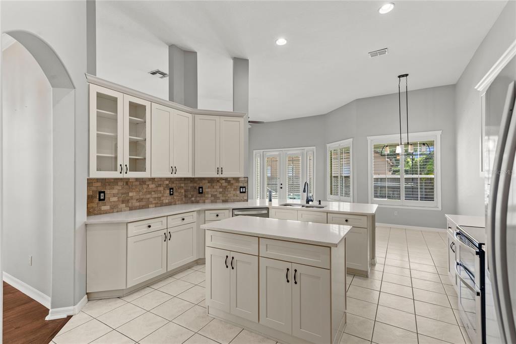 121 Figtree Run Longwood, FL 32750 - Photo 8 of 33 a kitchen with a sink cabinets and window