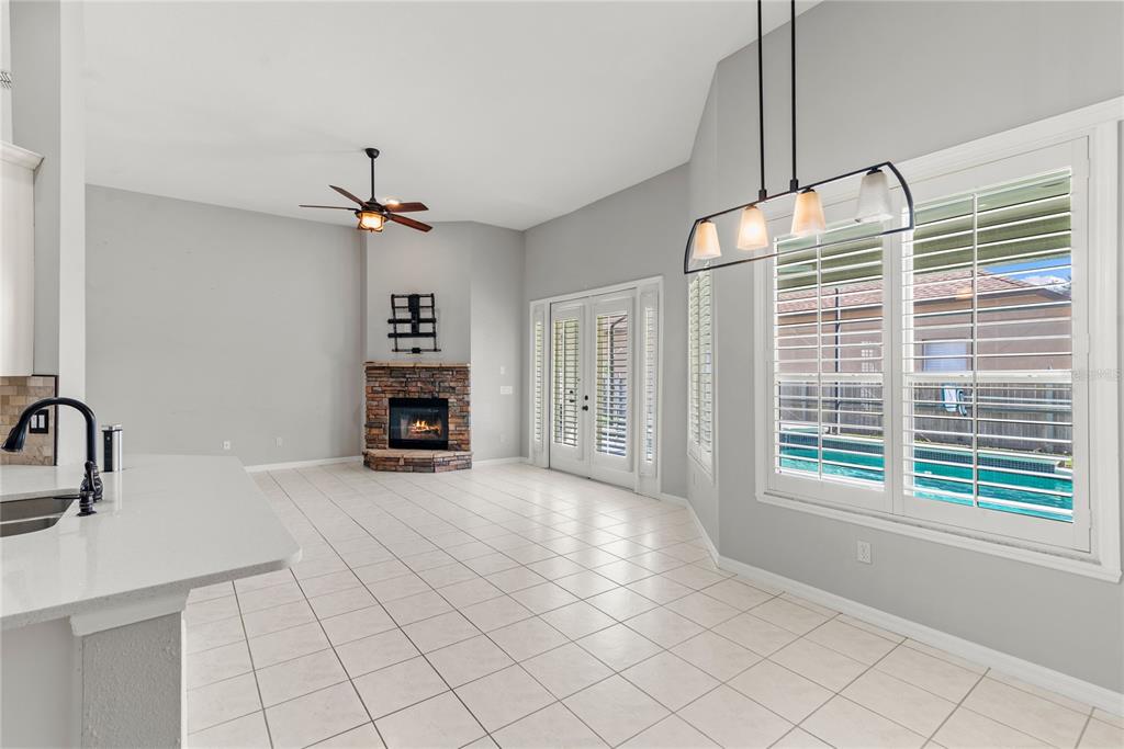 121 Figtree Run Longwood, FL 32750 - Photo 10 of 33 a view of a kitchen with a sink and a chandelier fire place