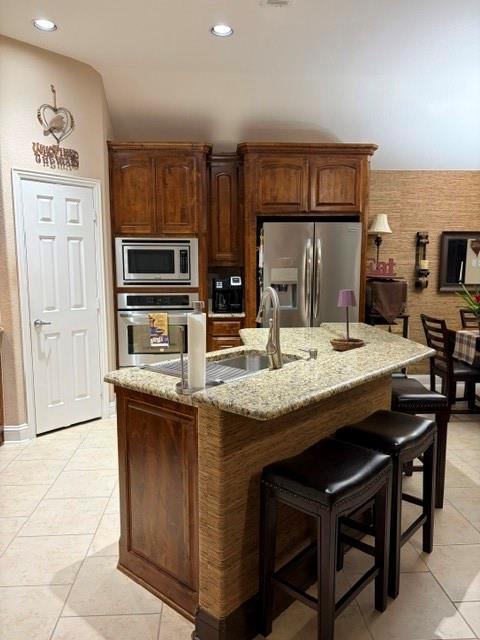 202 Tower Circle Terrell, TX 75160 - Photo 11 of 39 a kitchen with stainless steel appliances granite countertop a sink and a refrigerator
