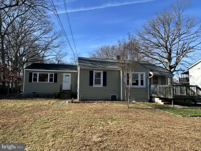 a house with trees in front of it