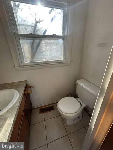a bathroom with a toilet and a sink