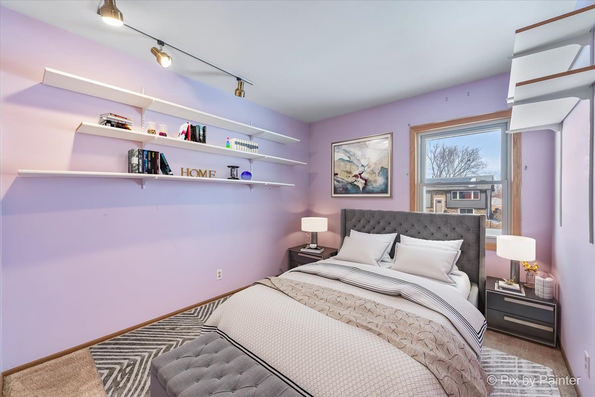 411 Krause Avenue Streamwood, IL 60107 - Photo 22 of 54 a bedroom with a bed and cabinets
