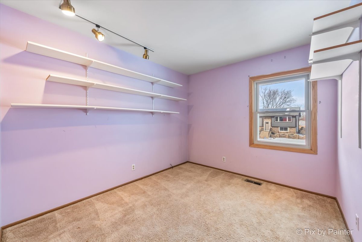 411 Krause Avenue Streamwood, IL 60107 - Photo 23 of 54 a view of an empty room with a window