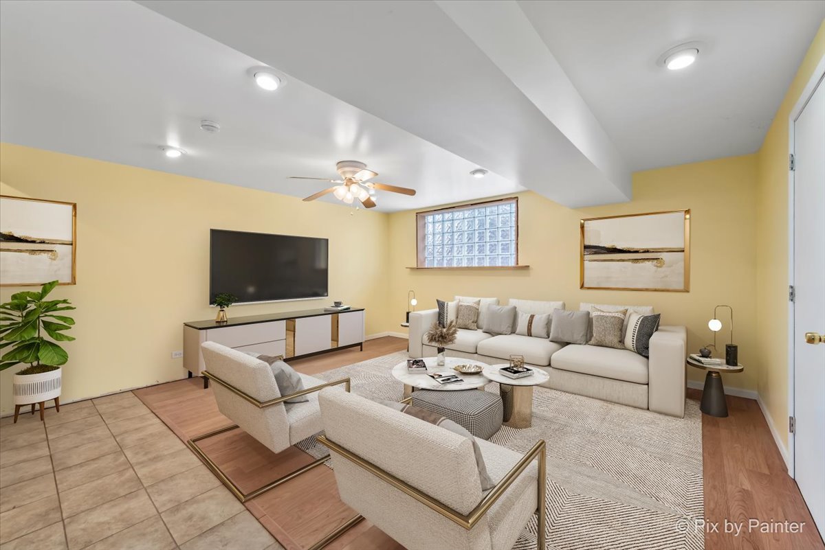411 Krause Avenue Streamwood, IL 60107 - Photo 25 of 54 a living room with furniture and a flat screen tv