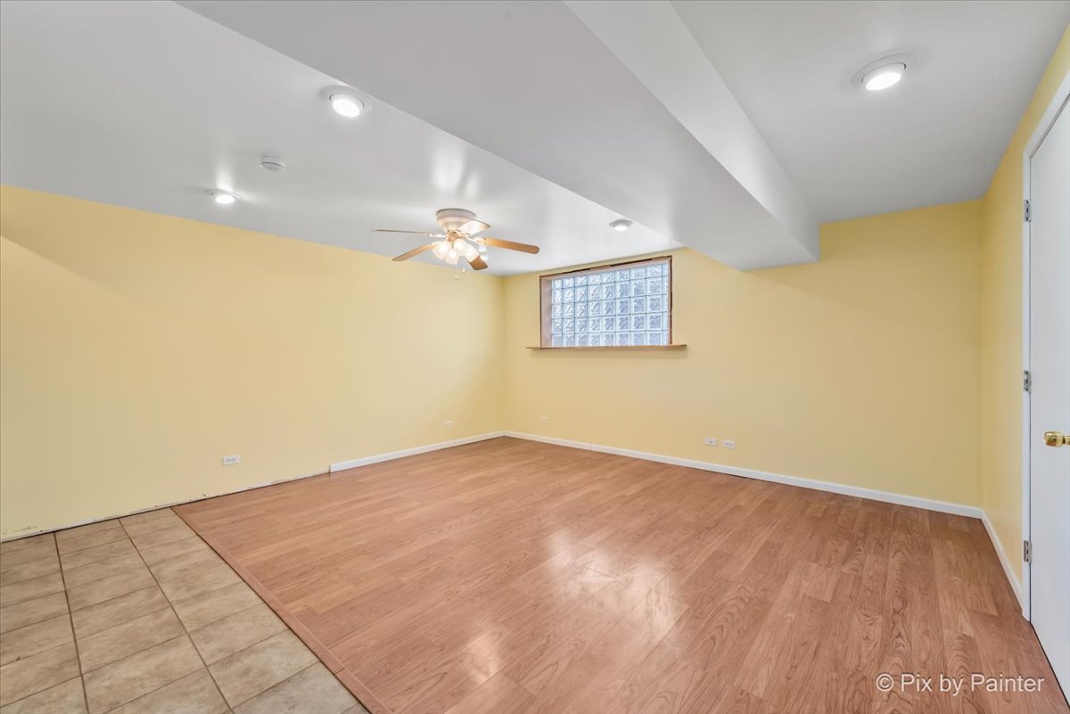 411 Krause Avenue Streamwood, IL 60107 - Photo 26 of 54 wooden floor in a hall with a window