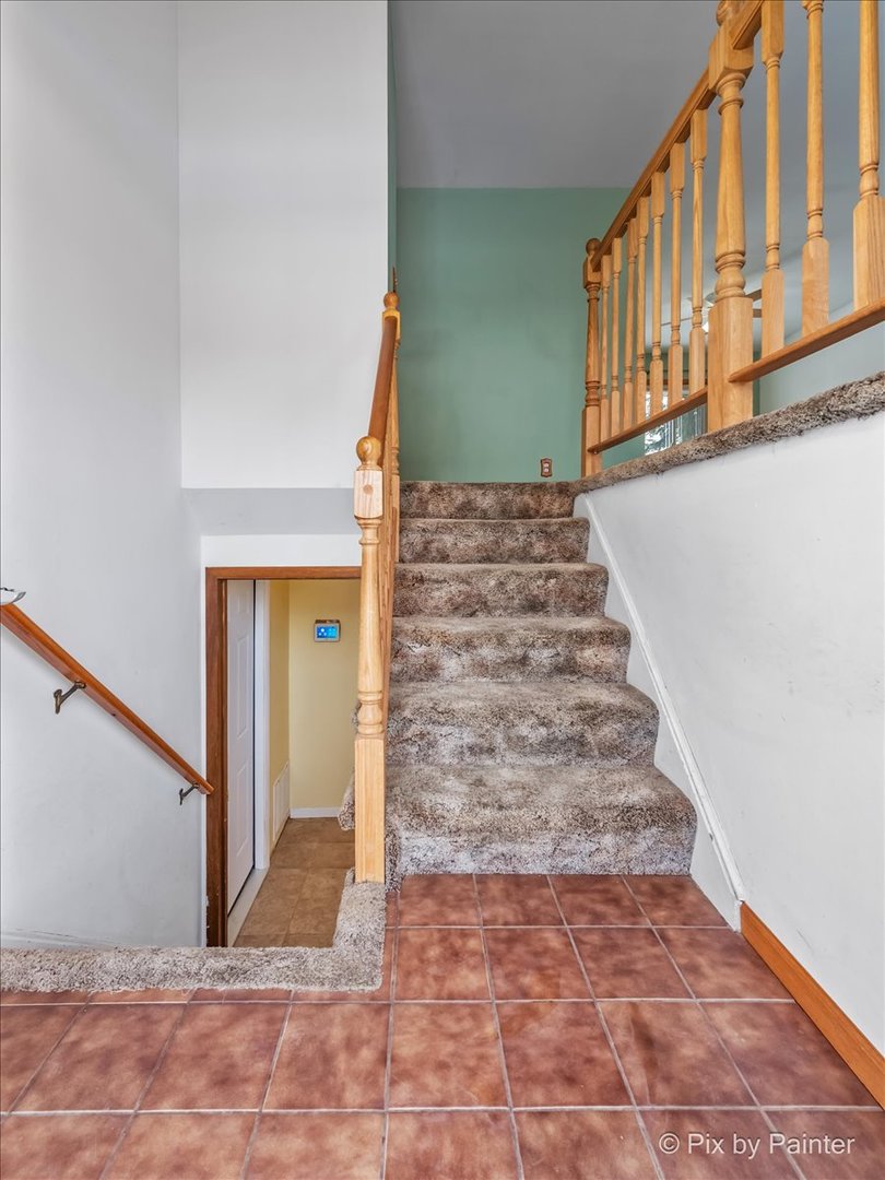 411 Krause Avenue Streamwood, IL 60107 - Photo 3 of 54 a view of an entryway with staircase