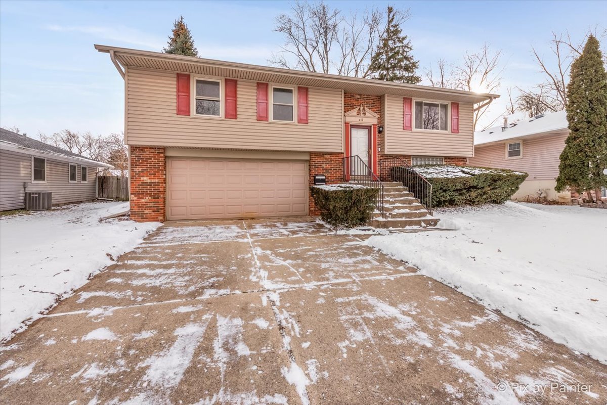 411 Krause Avenue Streamwood, IL 60107 - Photo 41 of 54 a front view of a house with a yard