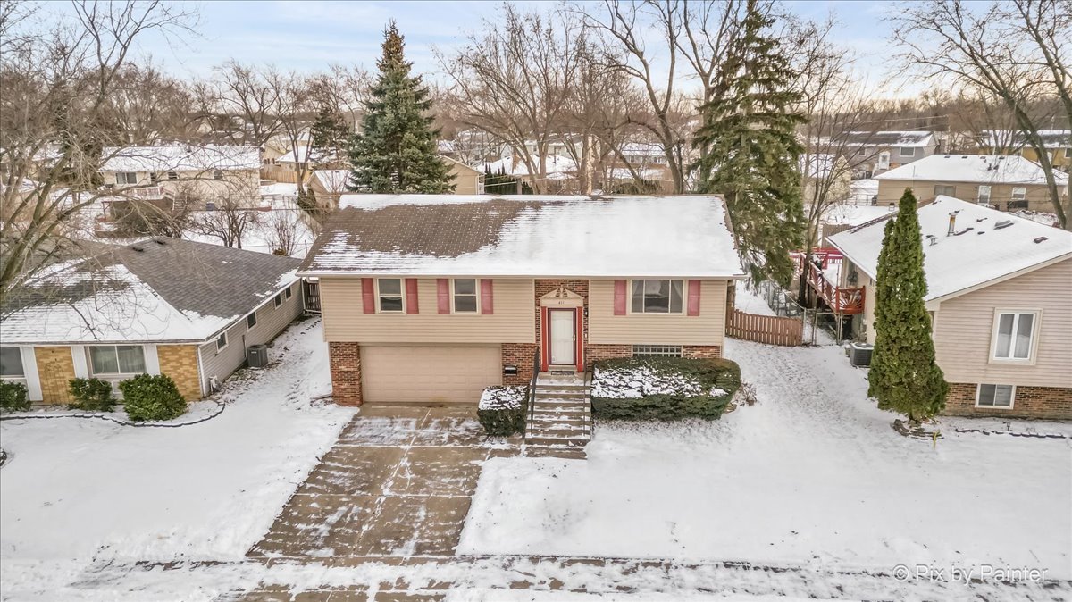 411 Krause Avenue Streamwood, IL 60107 - Photo 45 of 54 a front view of a house with a yard