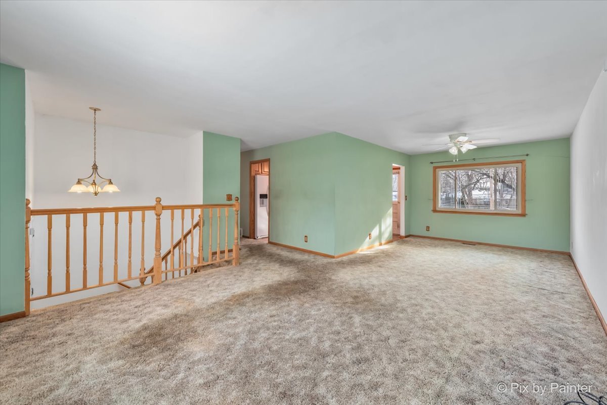 411 Krause Avenue Streamwood, IL 60107 - Photo 5 of 54 a view of an empty room with stairs