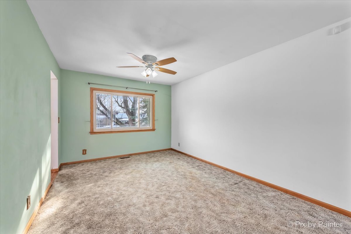 411 Krause Avenue Streamwood, IL 60107 - Photo 8 of 54 an empty room with windows