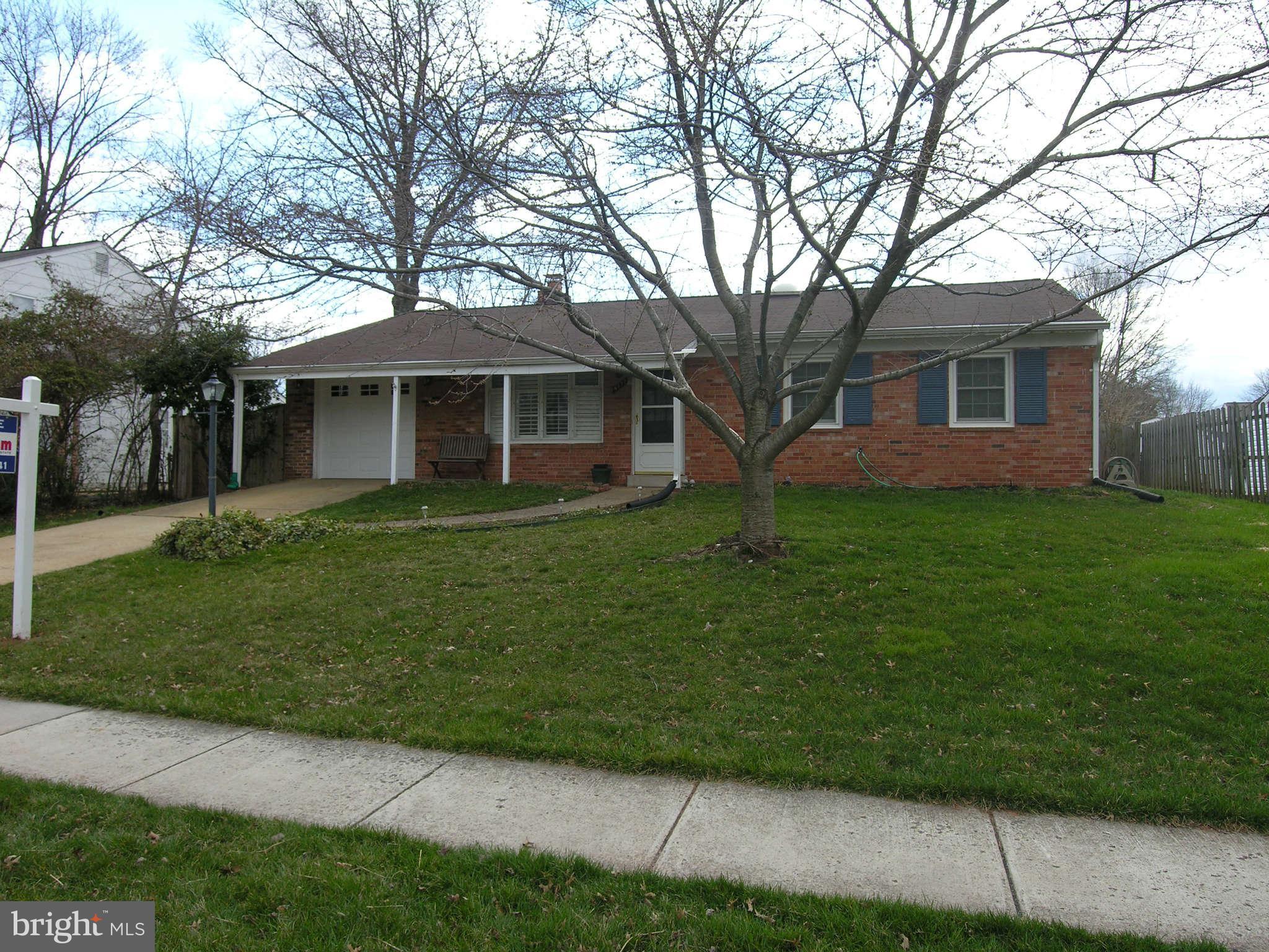 4111 Lees Corner Road Chantilly, VA 20151 - Photo 1 of 19 a front view of a house with a garden