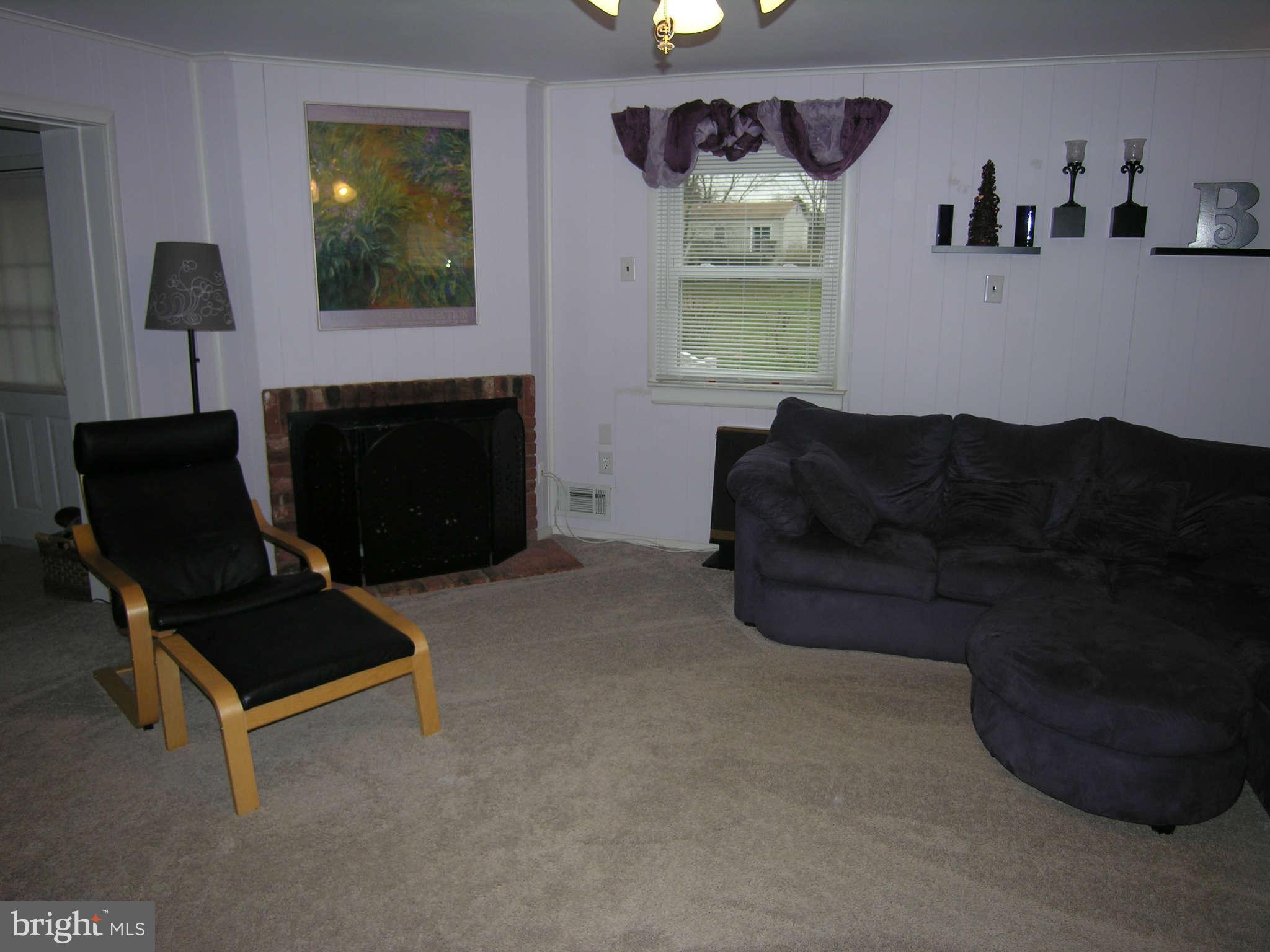 4111 Lees Corner Road Chantilly, VA 20151 - Photo 11 of 19 a living room with furniture and a fireplace