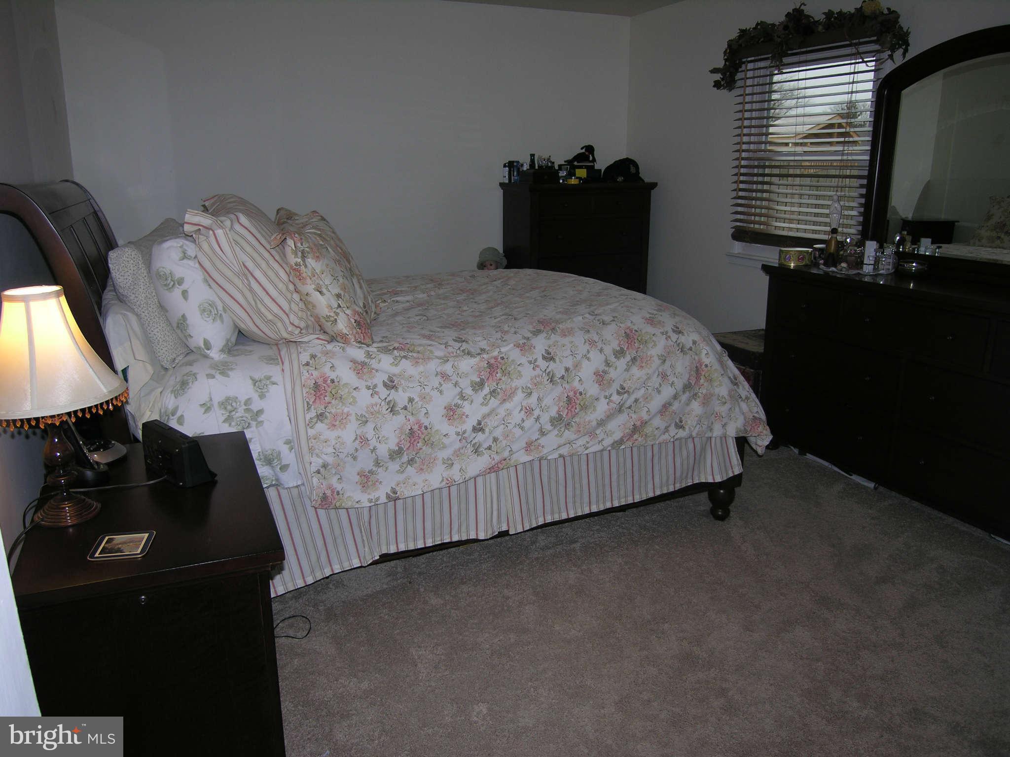4111 Lees Corner Road Chantilly, VA 20151 - Photo 15 of 19 a bed sitting in a bedroom next to a window