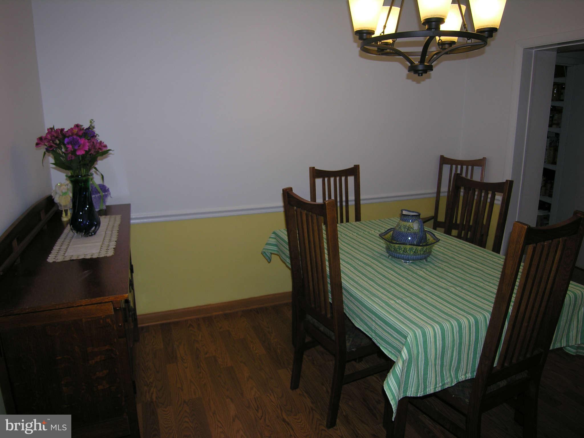 4111 Lees Corner Road Chantilly, VA 20151 - Photo 8 of 19 a view of a dining room with furniture and wooden floor