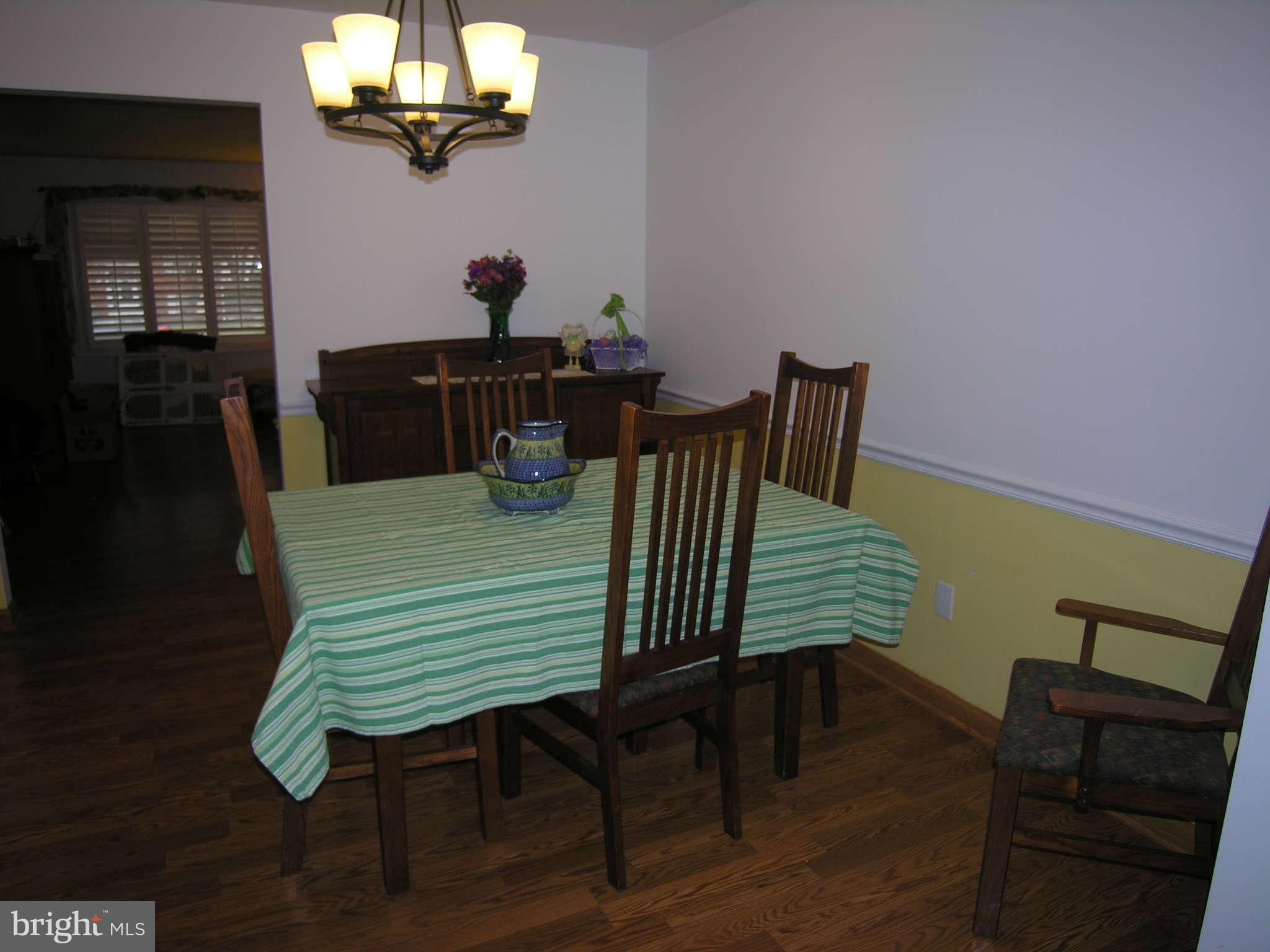 4111 Lees Corner Road Chantilly, VA 20151 - Photo 9 of 19 a view of a dining room with furniture and wooden floor
