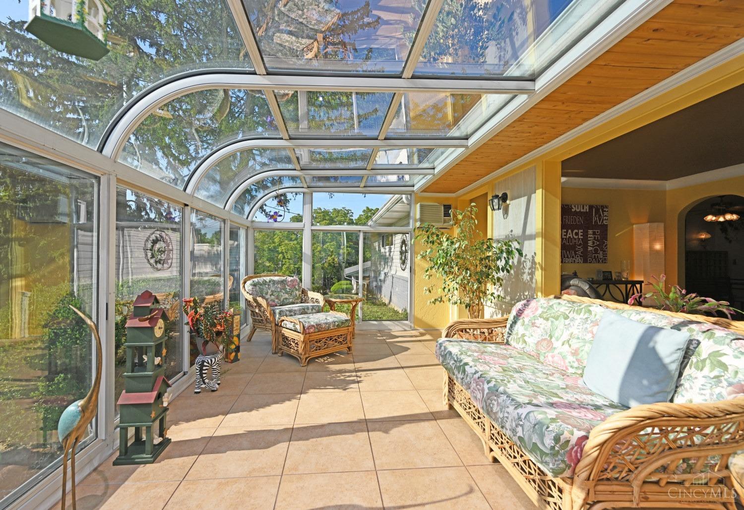 8704 Livingston Road Cincinnati, OH 45251 - Photo 6 of 89 Warm and inviting solarium with sliders to enjoy the changes of the seasons