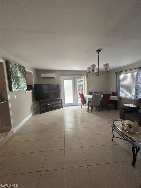 4920 Cortez Circle Naples, FL 34112 - Photo 5 of 7 a living room with furniture and a flat screen tv
