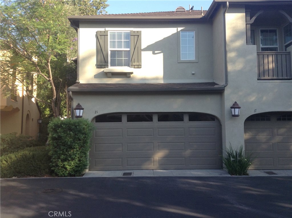 a front view of a house with garage