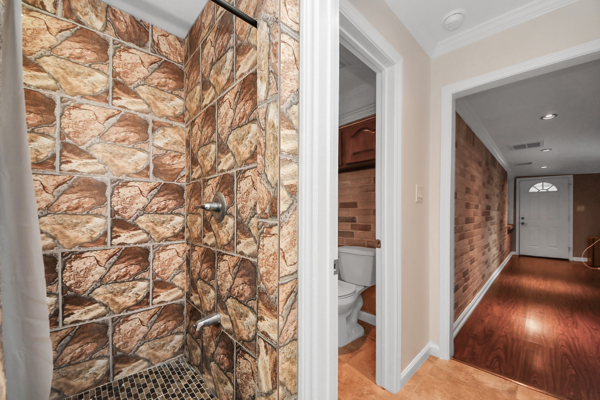 9634 Thistle Trail Drive Houston, TX 77070 - Photo 20 of 22 wooden floor in a hall with a window
