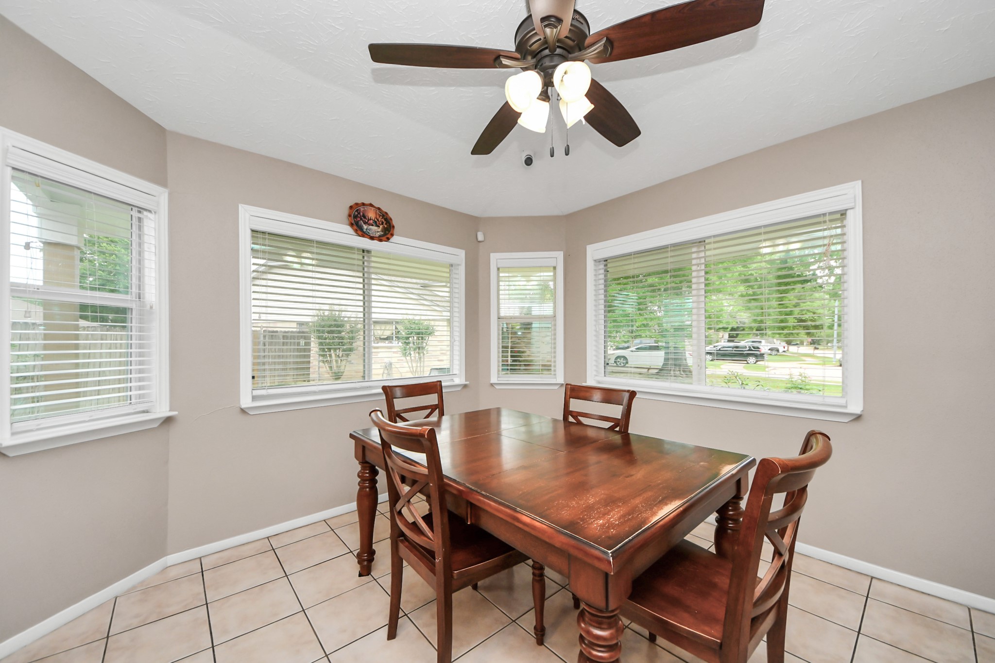 9634 Thistle Trail Drive Houston, TX 77070 - Photo 10 of 22 a dining room with furniture a chandelier and window