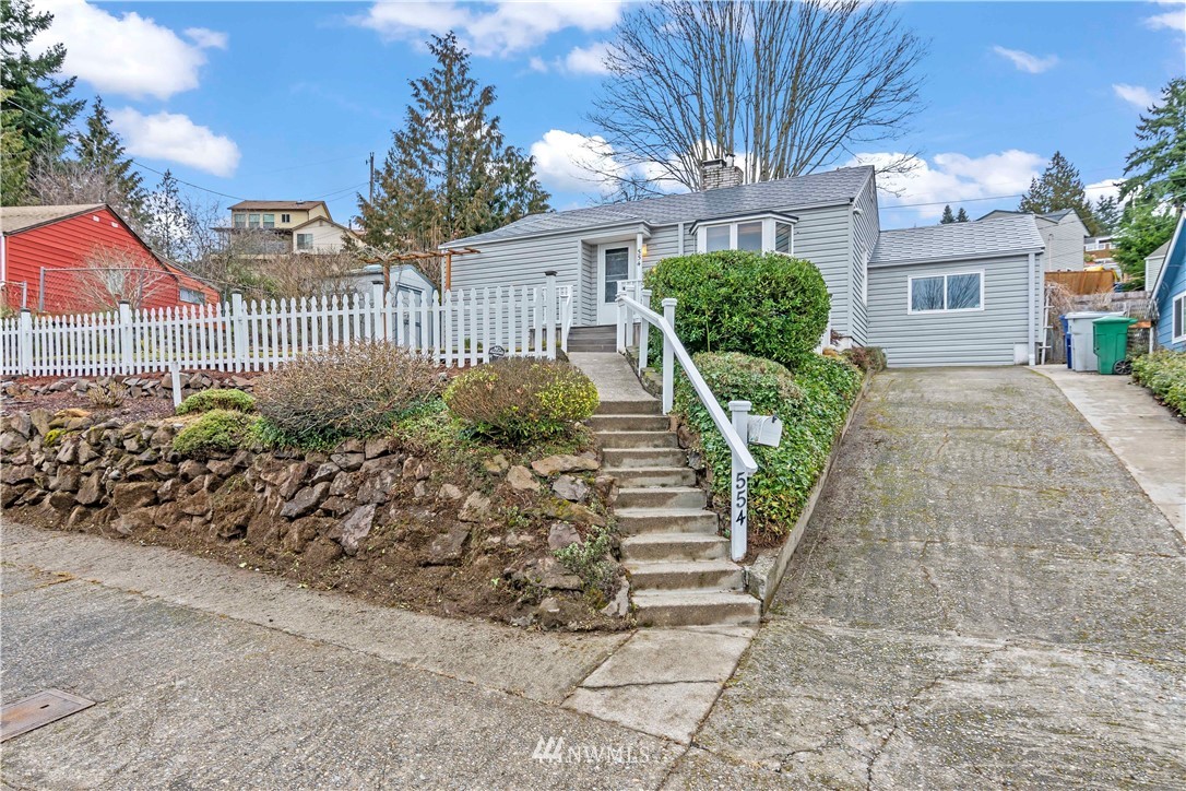 554 Bronson Way Northeast Renton, WA 98056 - Photo 1 of 35 a view of a garden with potted plants