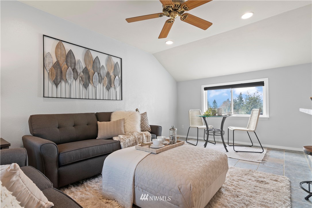 554 Bronson Way Northeast Renton, WA 98056 - Photo 11 of 35 a living room with furniture and a large window