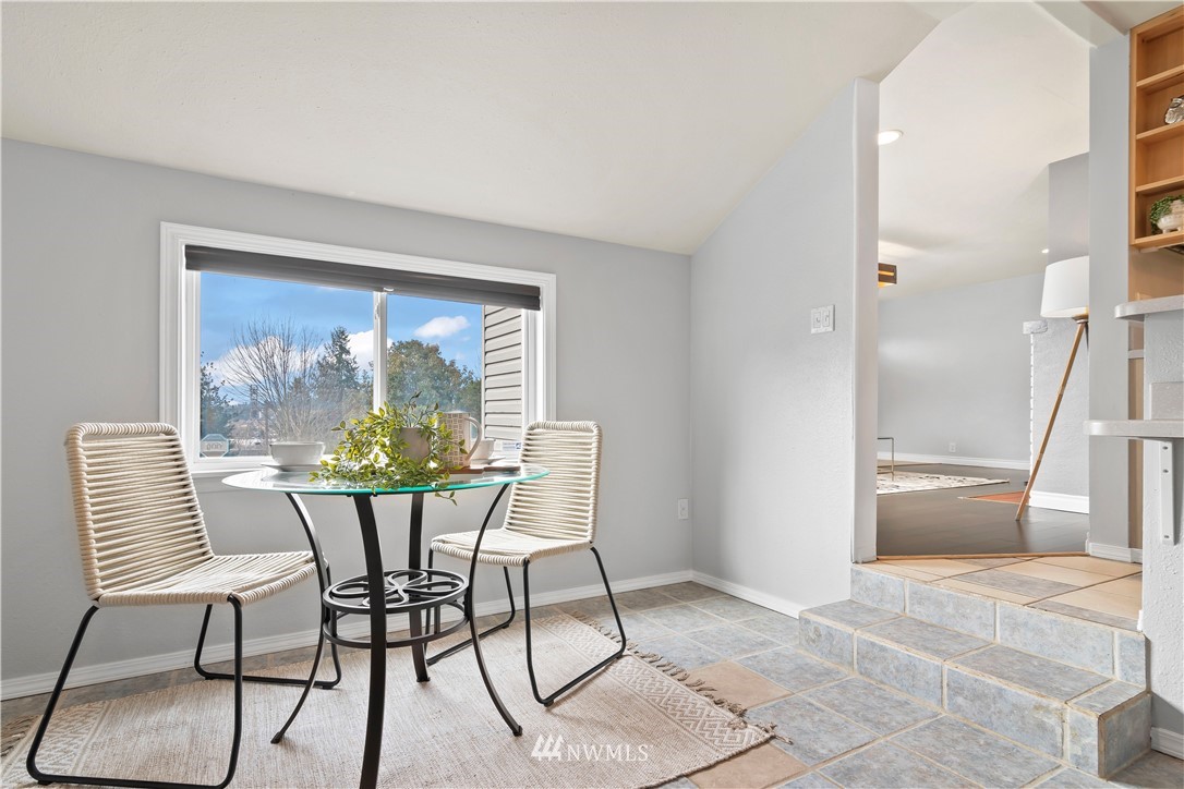 554 Bronson Way Northeast Renton, WA 98056 - Photo 12 of 35 a view of a dining room with furniture window and outside view