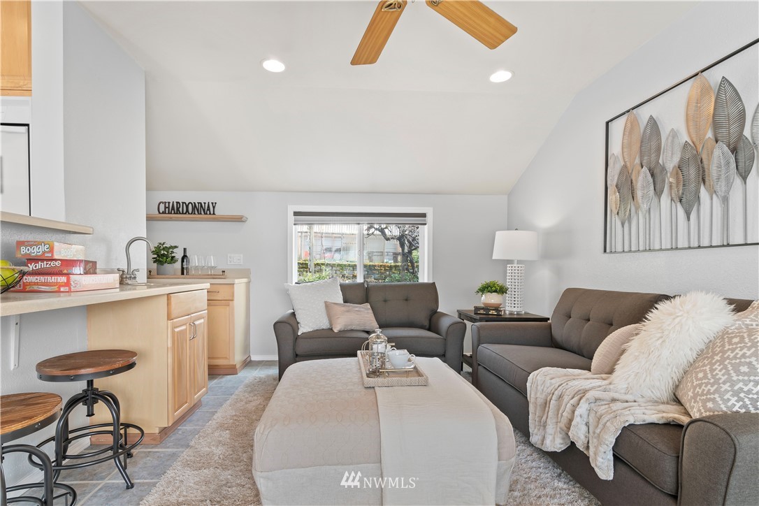 554 Bronson Way Northeast Renton, WA 98056 - Photo 13 of 35 a living room with furniture and a large window